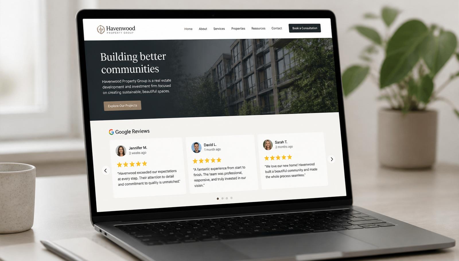 Laptop on a bright desk showing a business website homepage with an embedded Google reviews widget displaying five-star review cards